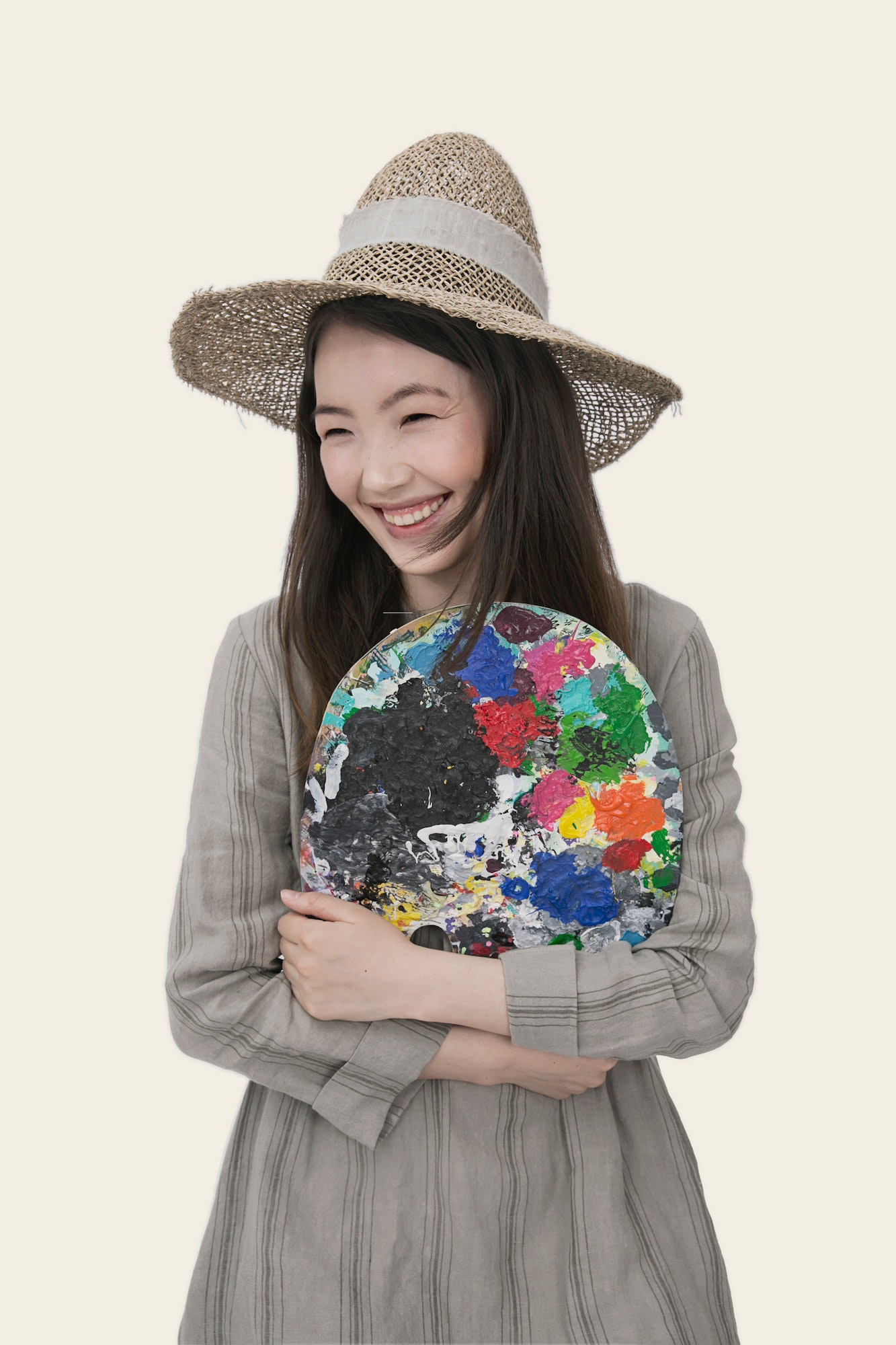 Artist holding a colourful paint palette